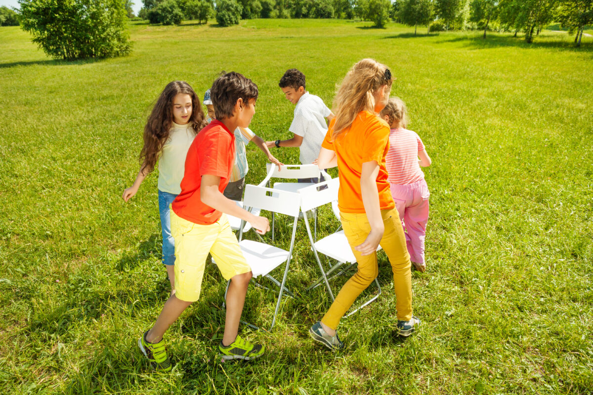 Children playing musical chairs. 