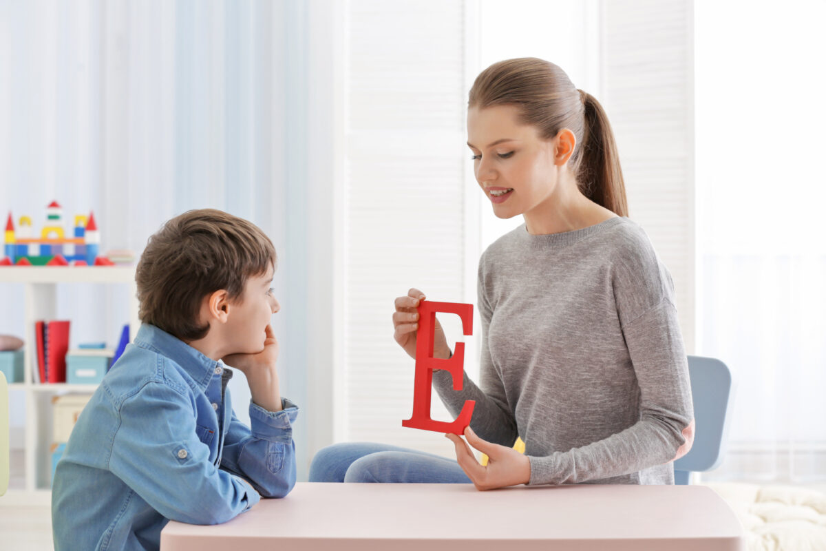 Mom teaching her son about the silent letter e. 