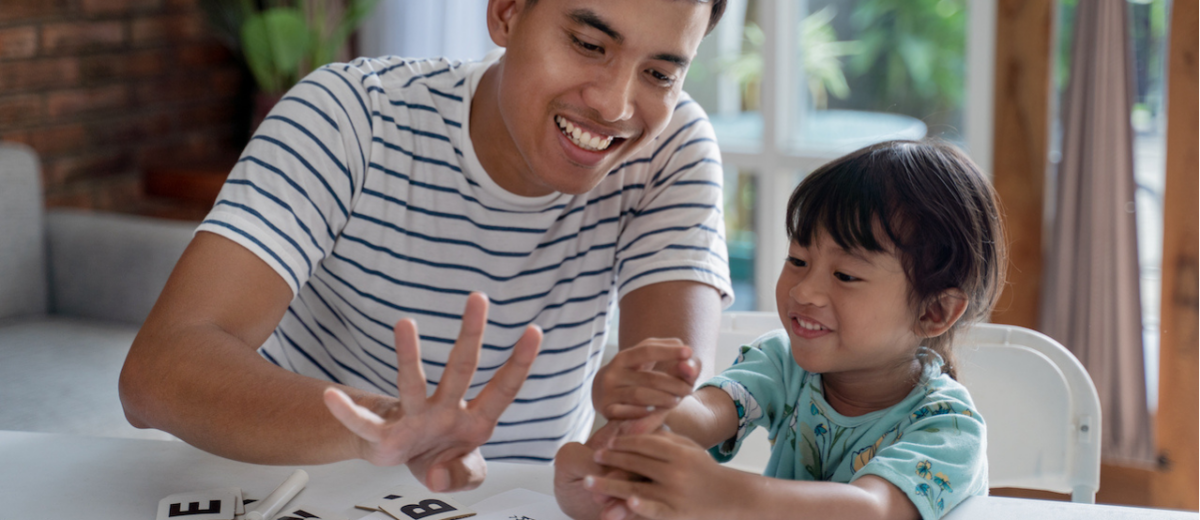 Father counting and learning math with his daughter. 