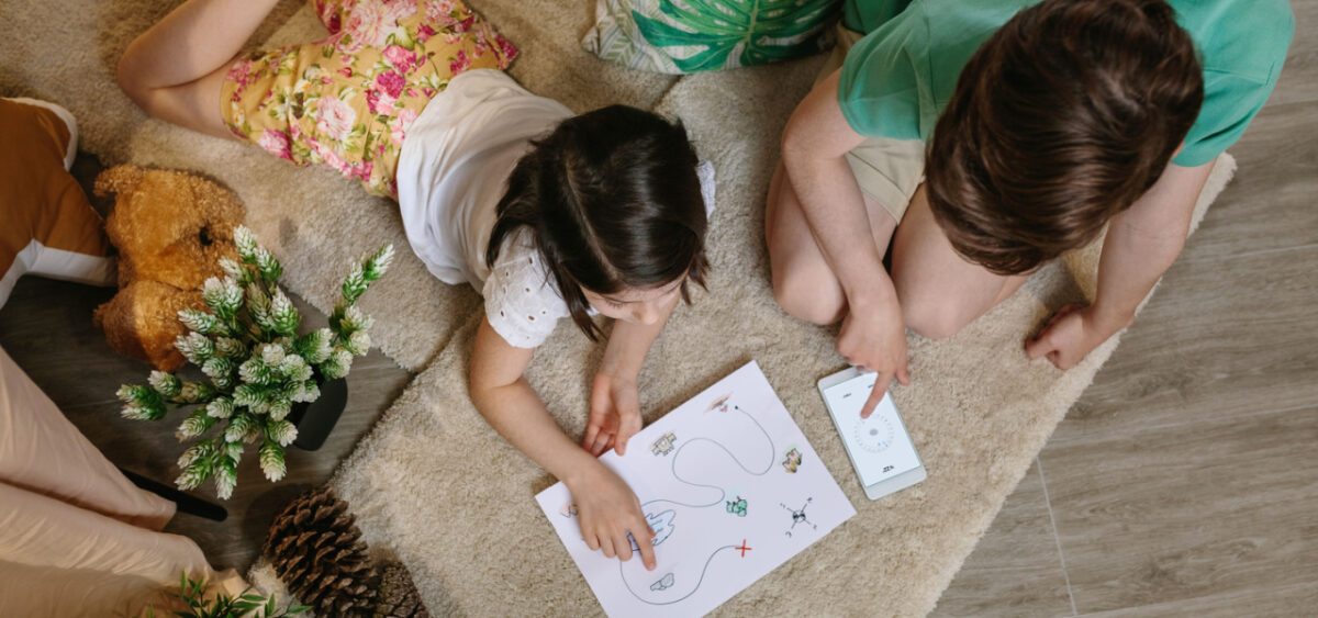 Children looking at a treasure map.