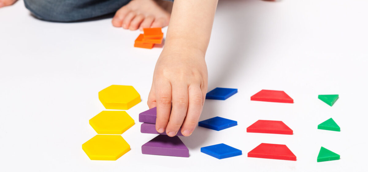 A child working on patterns and shapes.