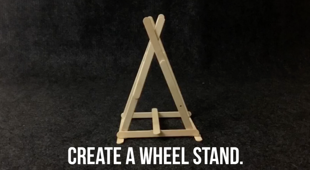 Popsicle sticks forming the base of a Ferris Wheel for this STEM activity by ABCmouse. 