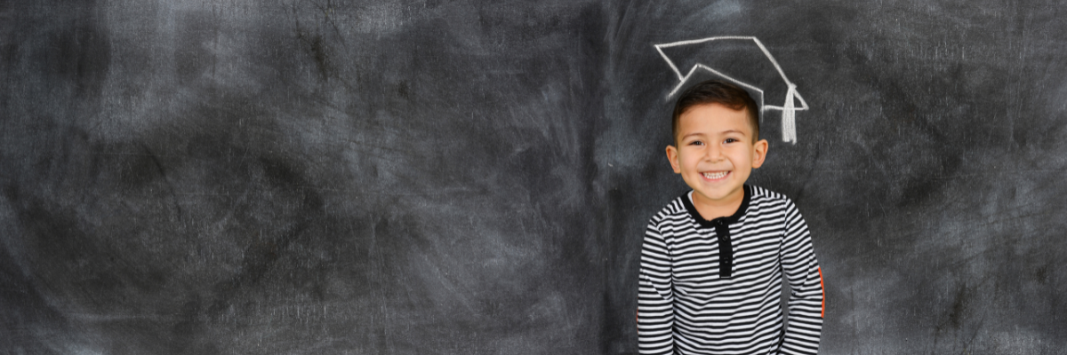 A kindergarten graduate getting ready to go into 1st grade. 