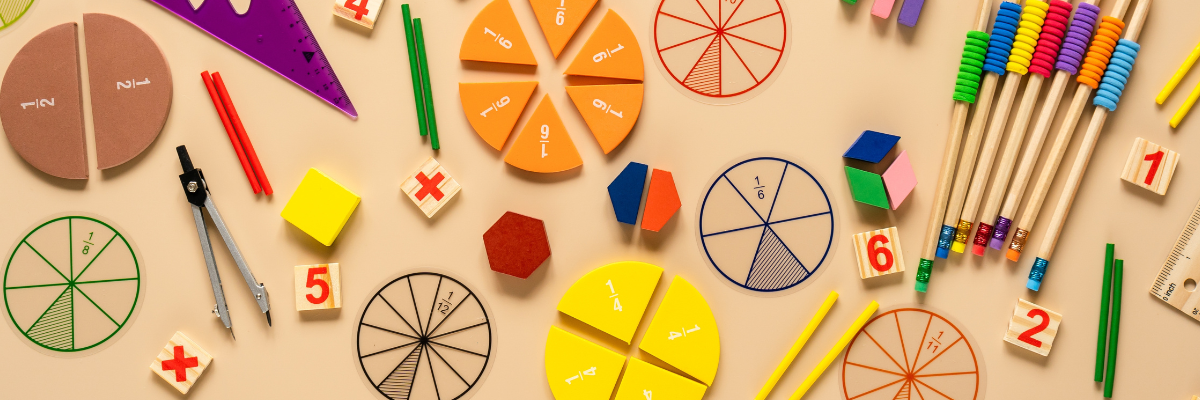 Colorful math and fraction items on a table. 