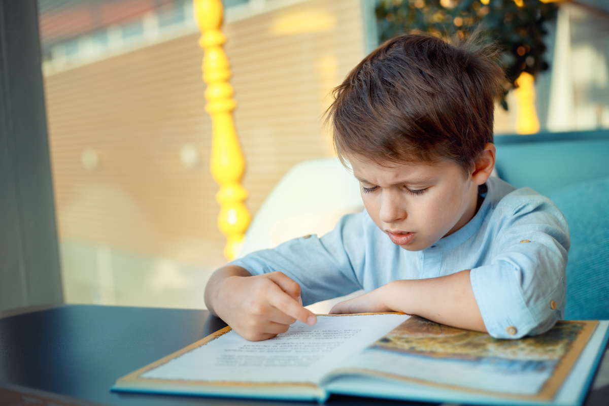 A boy who is struggling to read. 