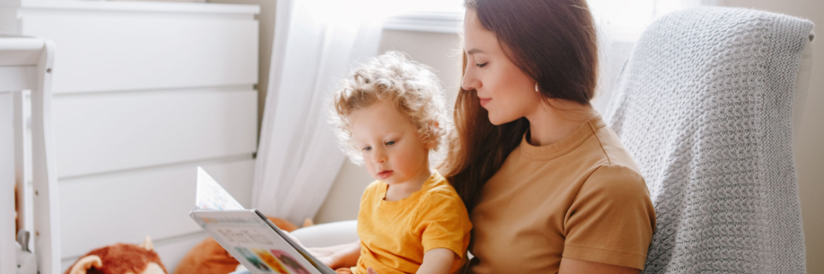 Mother reading to her preschool age child. 