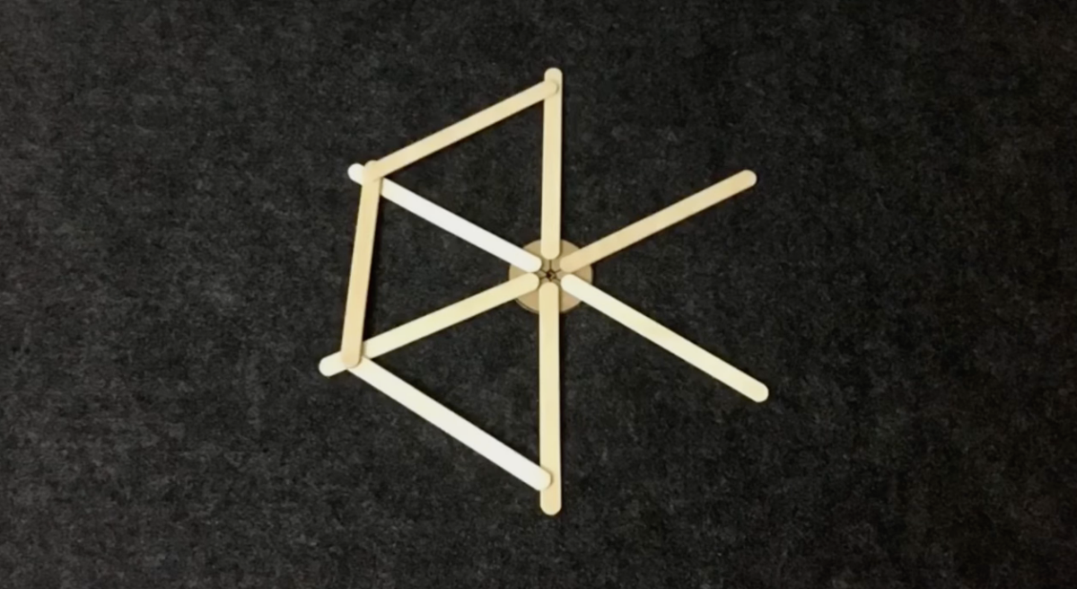 The beginning of a popsicle stick Ferris wheel. 
