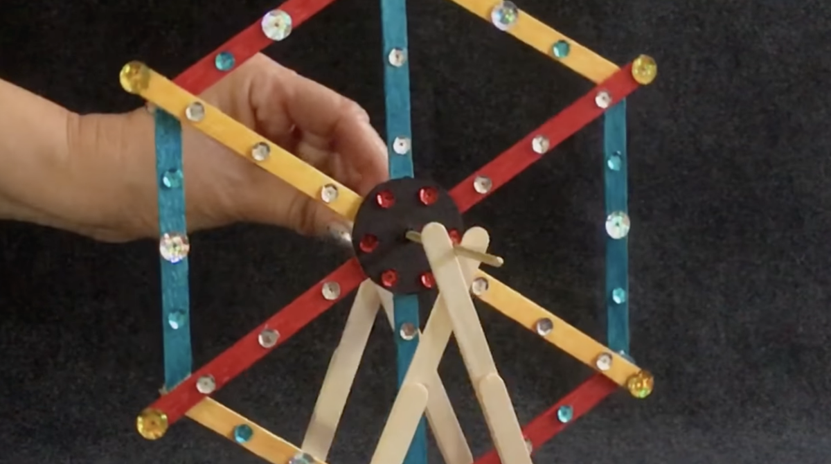 A colorful popsicle stick Ferris wheel. 