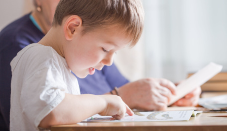 A child learning to read. 