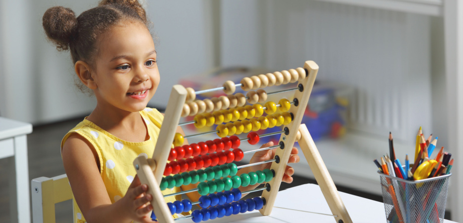 A child using an abacus. 