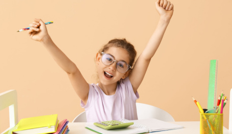 A happy child cheering. 