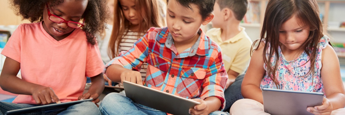 Children working on I-Pads. 