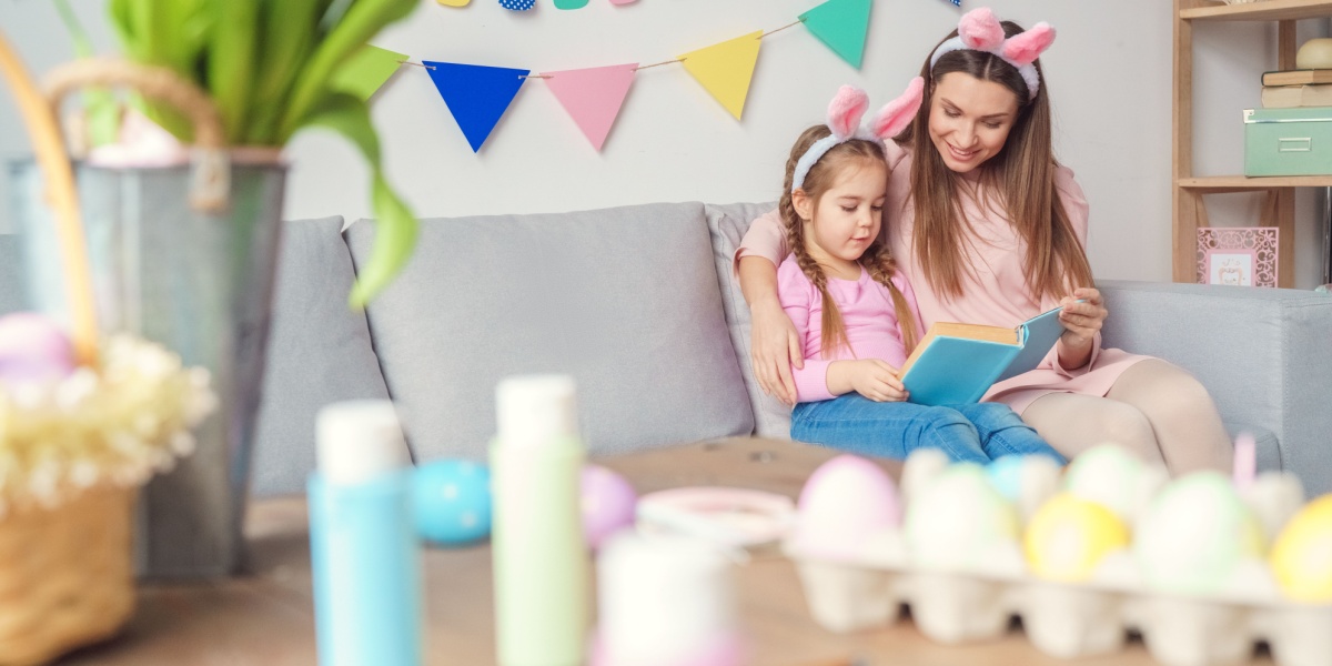 Mom and child reading together during Easter