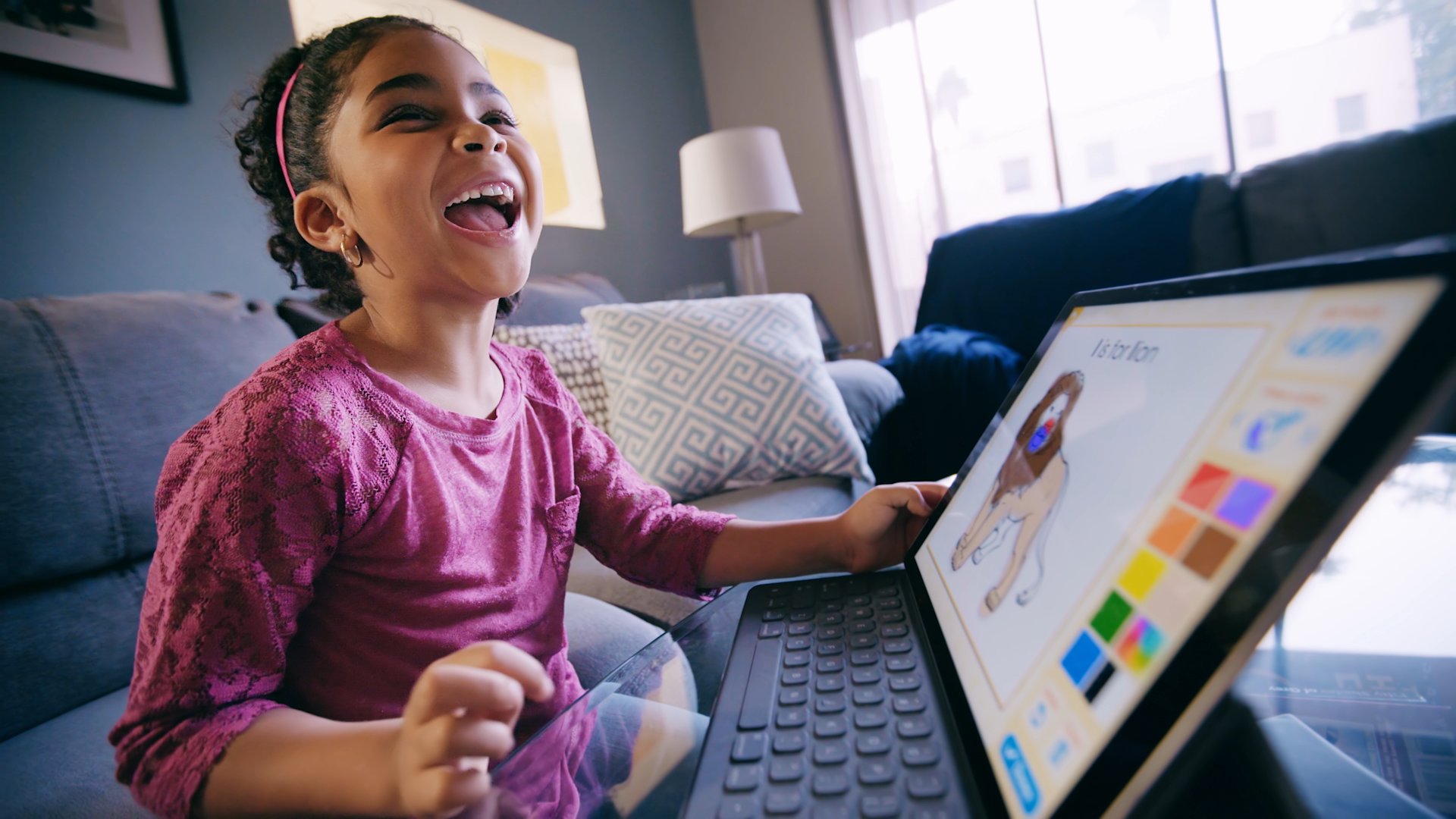 A child having fun playing ABCmouse.com online a popular game based learning app for kids ages 2-8. 