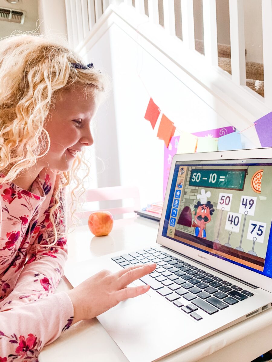 A girl playing a math game on ABCmouse.com online a popular game based learning app for kids ages 2-8. 