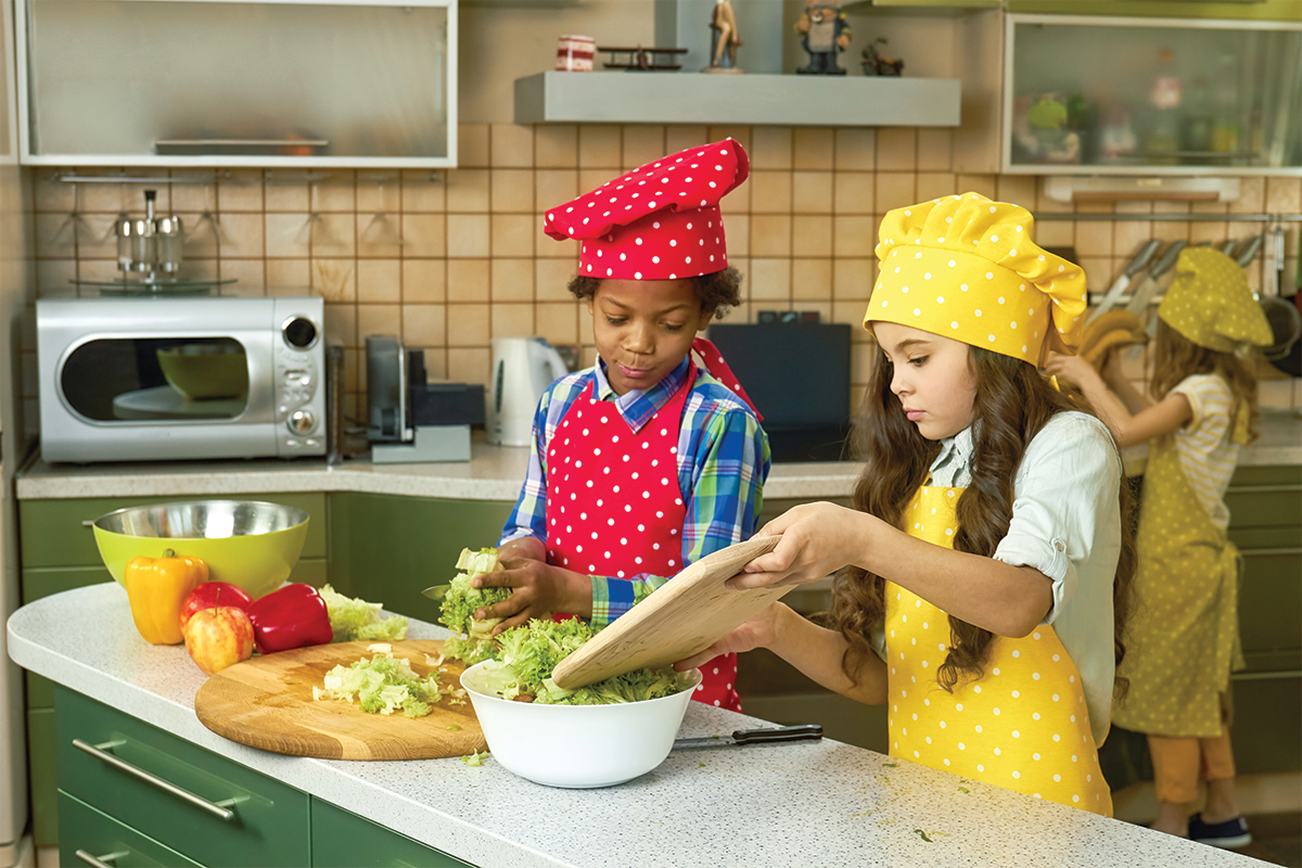 Kids cooking together  for a fun summer activity. 
