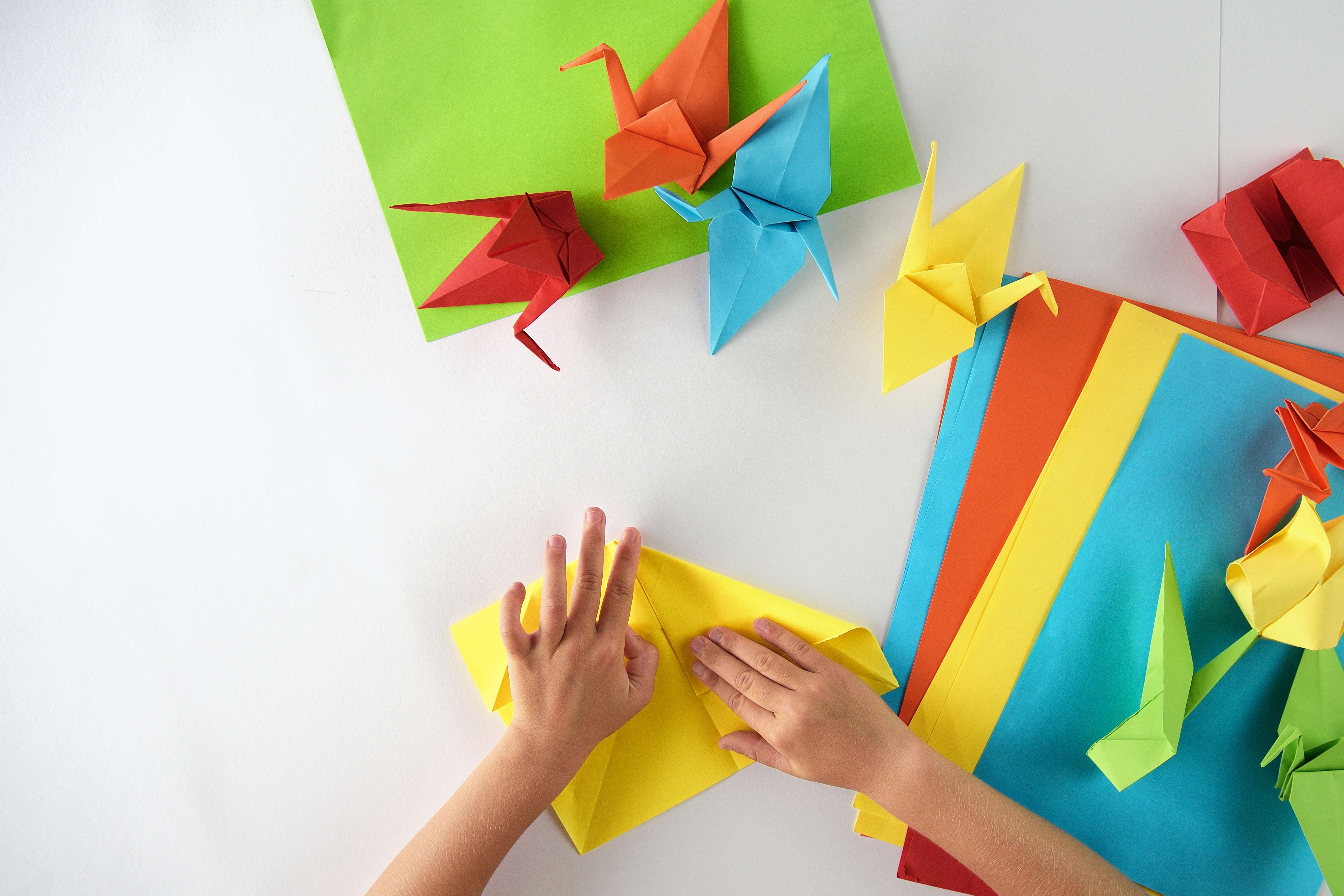 Colorful paper origami folded birds.