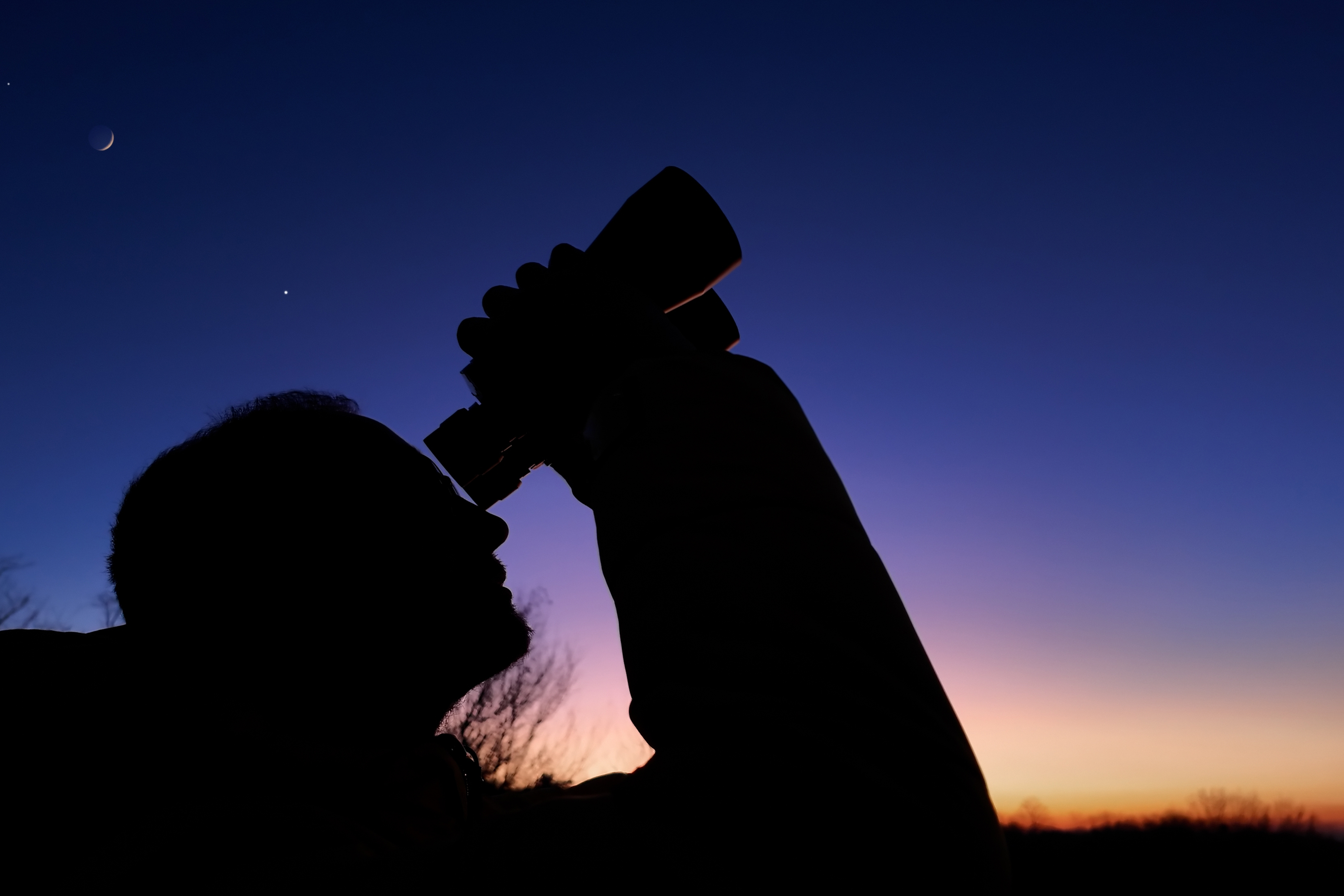 Looking at stars through binoculars on a nice clear summer night.