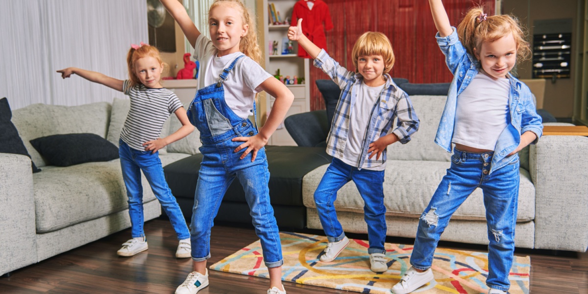 A group of children dancing together in cooperative play. 