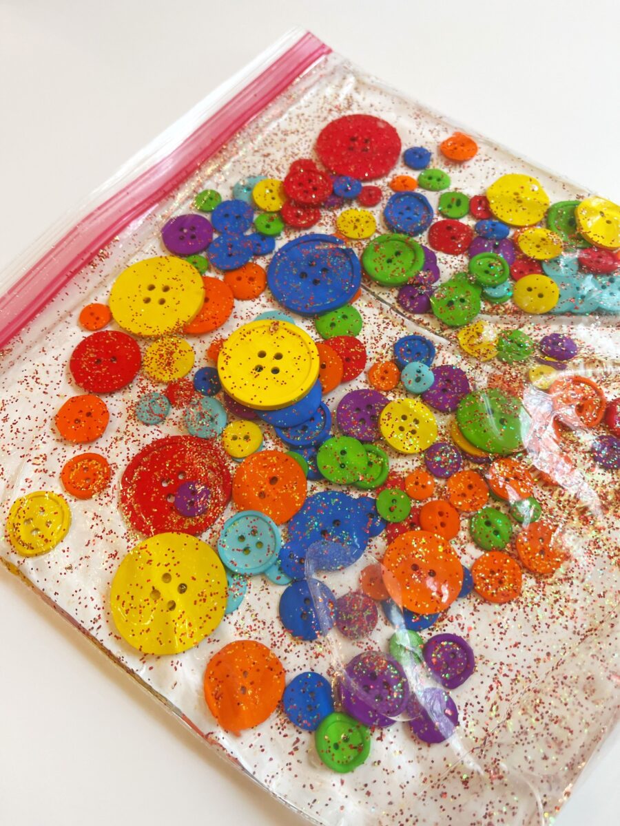 A sensory bag of buttons and glitter for kids to play with.