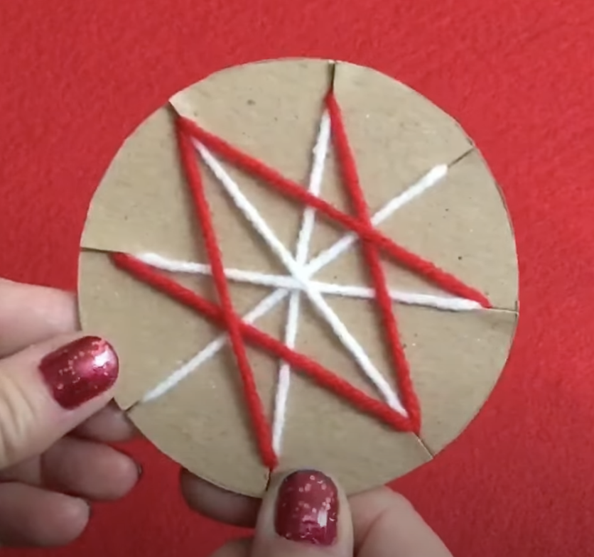 A fun yarn wrapped ornament craft for kids to make for Christmas time. 