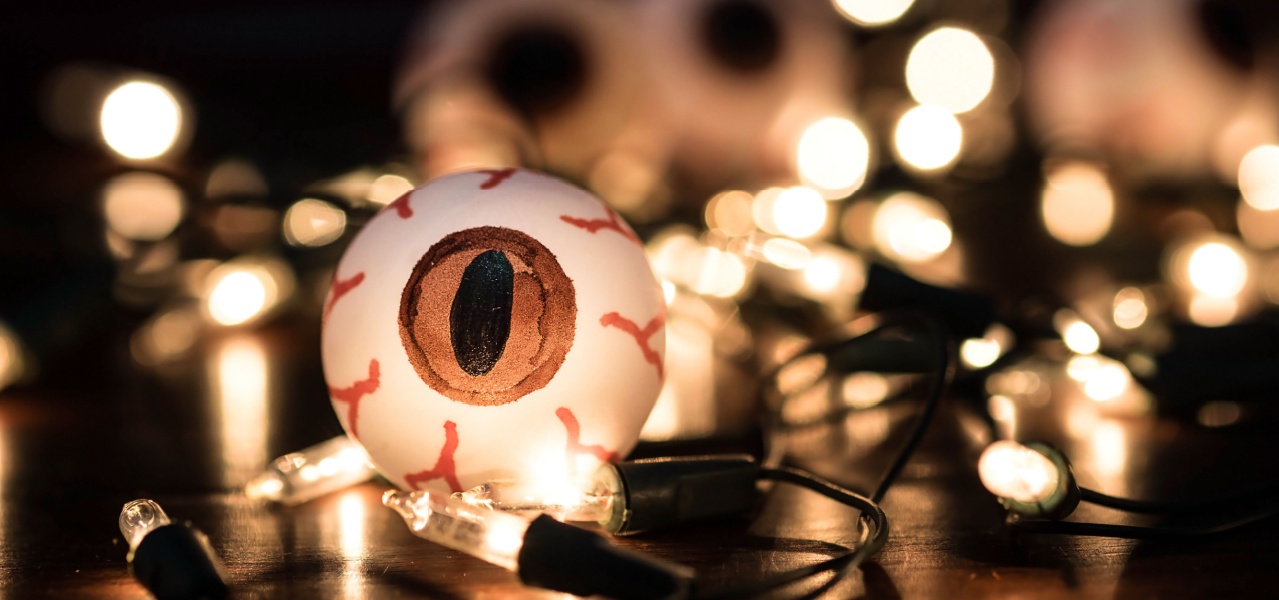 A ping pong ball decorated to look like and eyeball. 