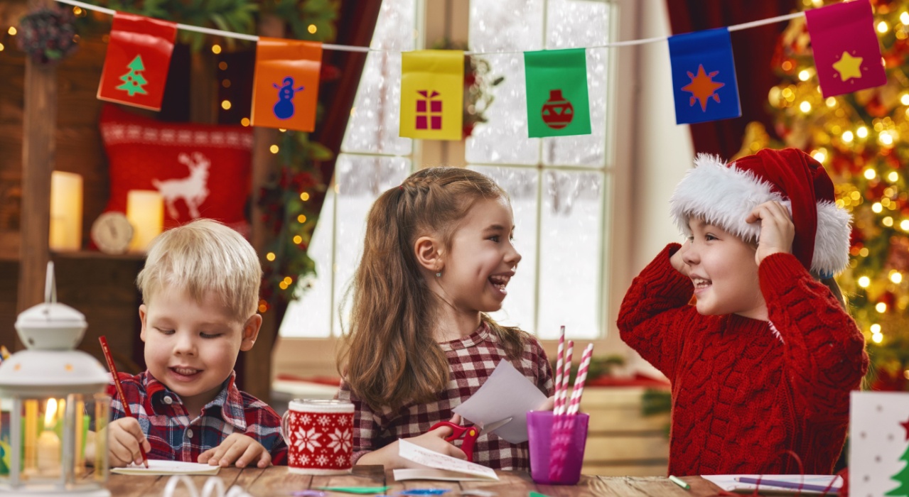 Children making Christmas crafts together.
