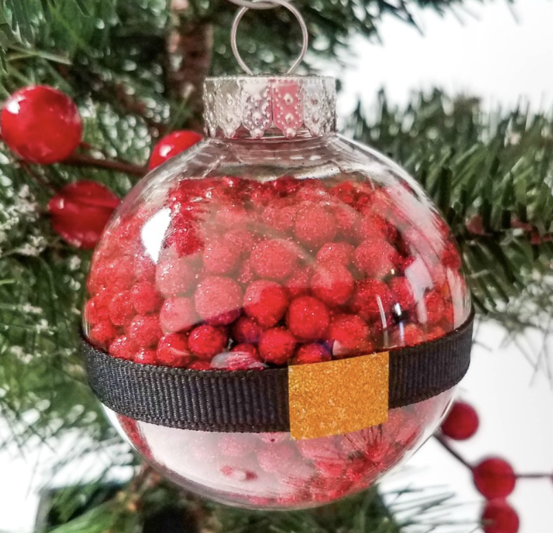 Fun red colorful Santa ornament craft for kids to make and hang on a Christmas tree. 