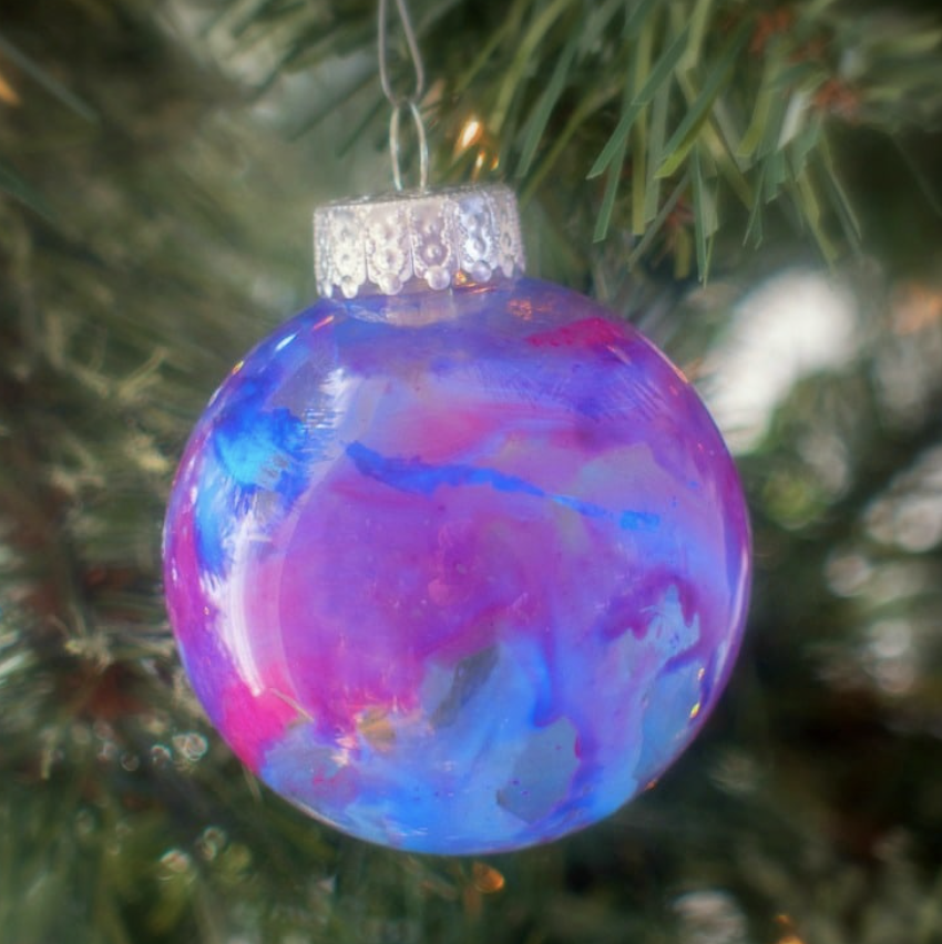 A colorful crayon Christmas bulb craft for kids. 