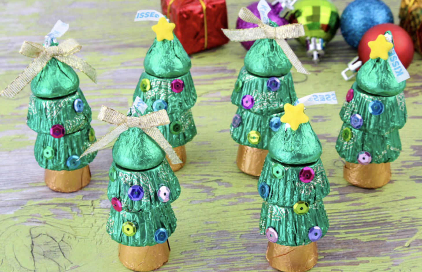 Fun Christmas candy trees made from recess butter cups and chocolate kisses. 