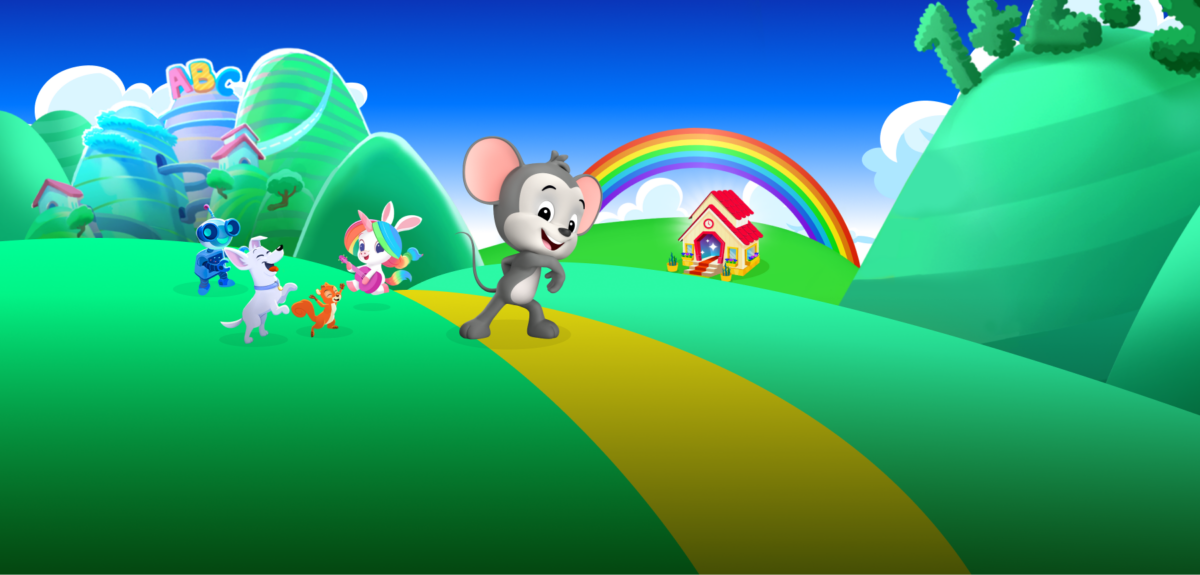 A cheerful cartoon scene shows a smiling gray mouse walking along a yellow path through bright green hills, followed by friendly animal characters. In the background are a rainbow, a small colorful house, fluffy clouds, and a whimsical learning landscape with playful buildings and trees under a blue sky.