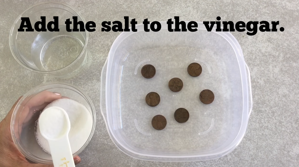 Adding salt to a bowl of white vinegar for a penny cleaning science experiment