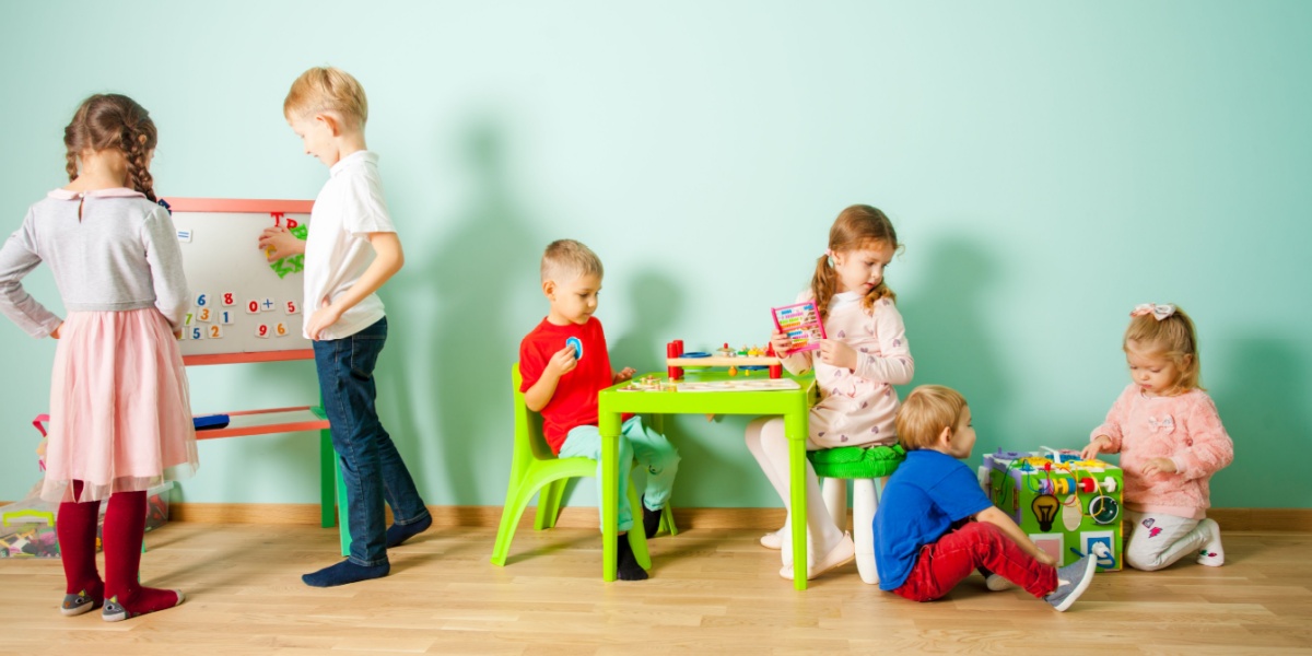 Classroom of multi-age students playing and learning