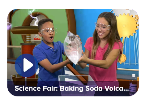 Video thumbnail of two kids in safety goggles performing a baking soda volcano experiment, with a play button overlay and the caption 'Science Fair: Baking Soda Volcano...''
