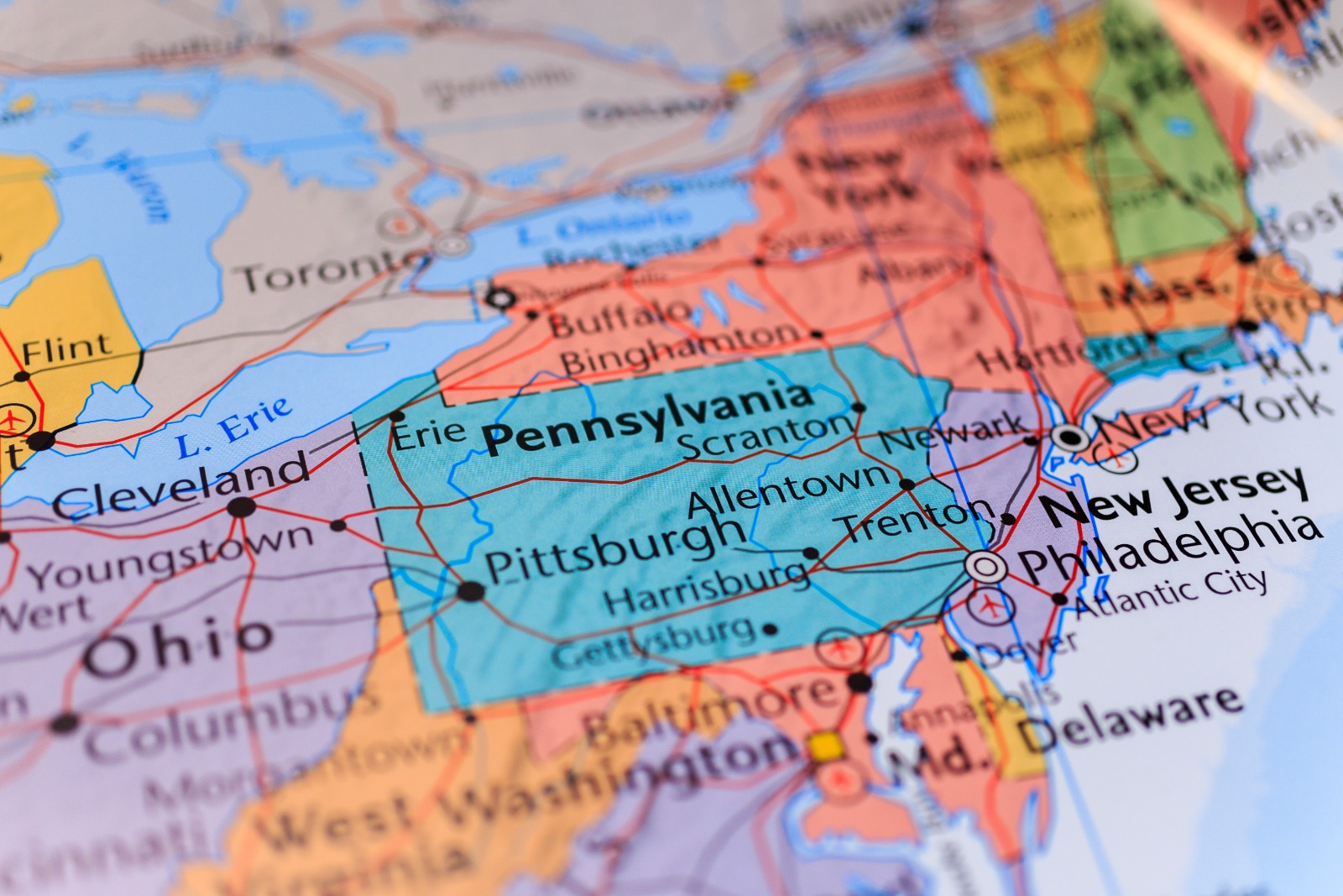 Close-up of a colorful political map focusing on Pennsylvania and surrounding states, with cities like Pittsburgh, Scranton, Allentown and New York visible.
