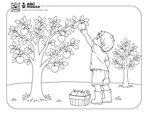 Young boy reaching up to pick an apple beside a basket in an orchard—free printable coloring page for kids from ABCmouse.com.