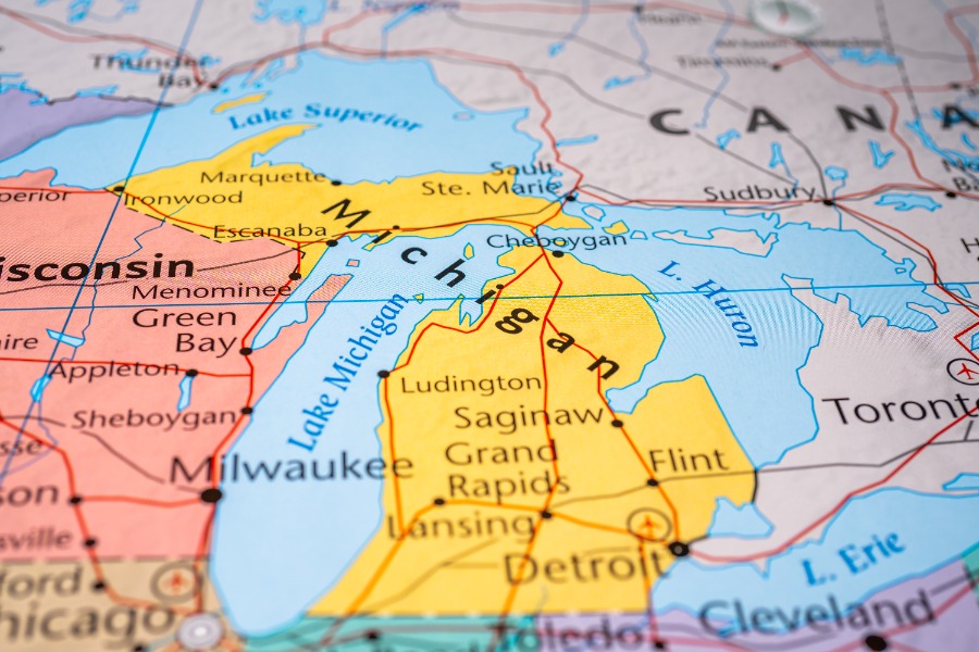 Map of the Midwest centered on Michigan, showing Lake Michigan and cities like Detroit, Grand Rapids, and Lansing on a colorful political map.