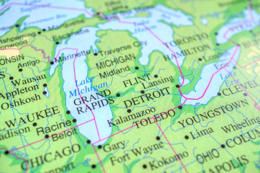 Section of a regional map showing Michigan cities like Detroit, Grand Rapids, Kalamazoo and surrounding area in green and blue tones.