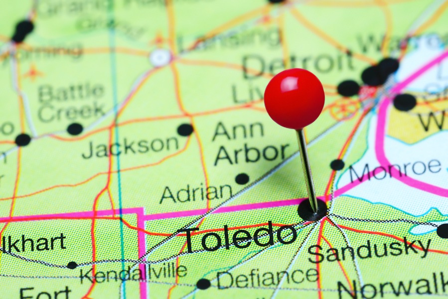 Close-up map with a red pin marking Toledo, Ohio, near Ann Arbor, Detroit, and Sandusky.